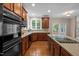 Well-appointed kitchen with modern appliances, ample counter space, and hardwood floors at 606 Churton Grove Blvd, Hillsborough, NC 27278