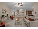 Open-concept living room with cozy seating, fireplace and staircase, providing a seamless flow to other living spaces at 606 Churton Grove Blvd, Hillsborough, NC 27278