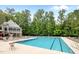 Large pool with lounge chairs, showcasing an outdoor recreation area at 606 Churton Grove Blvd, Hillsborough, NC 27278