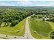 Expansive aerial shot featuring a scenic road leading to a property with extensive land at 61 Stone Ledge, Pittsboro, NC 27312