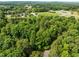 Stunning aerial view showing the expansive property with lush greenery and surrounding landscape at 61 Stone Ledge, Pittsboro, NC 27312