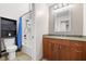 Bathroom featuring a wood vanity, shower and tub combo, and toilet with a shelf above at 61 Stone Ledge, Pittsboro, NC 27312