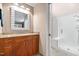 Bathroom featuring a vanity with wood cabinets, granite countertops, and a walk-in shower with a glass door at 61 Stone Ledge, Pittsboro, NC 27312