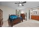 Spacious bedroom features a ceiling fan, carpeted floor, and an adjoining bathroom and walk-in closet at 61 Stone Ledge, Pittsboro, NC 27312