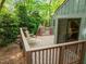 Wooden deck with stairs and views of the surrounding greenery at 61 Stone Ledge, Pittsboro, NC 27312