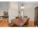 Dining room with hardwood floors, a wooden table with chairs, and traditional decor at 61 Stone Ledge, Pittsboro, NC 27312