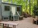 Back exterior with multiple entrances and wooden decks at 61 Stone Ledge, Pittsboro, NC 27312
