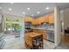 Charming eat-in kitchen features stainless steel appliances, granite countertops, and tile flooring at 61 Stone Ledge, Pittsboro, NC 27312