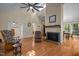 Bright living area boasts a fireplace, natural light, and beautiful hardwood flooring at 61 Stone Ledge, Pittsboro, NC 27312
