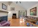 Spacious living room includes hardwood floors, fireplace and sliding door access to the outdoors at 61 Stone Ledge, Pittsboro, NC 27312