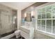 Modern bathroom with white subway tile, walk-in shower, and sleek vanity providing a spa-like atmosphere at 612 Swift Ave, Durham, NC 27701