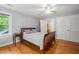 Bright bedroom with hardwood floors, ceiling fan, and double closets providing ample storage space at 612 Swift Ave, Durham, NC 27701