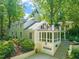Beautiful home exterior featuring a balcony, sunroom over the garage, and well-maintained landscaping at 612 Swift Ave, Durham, NC 27701