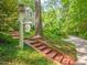 Beautiful home exterior featuring a brick pathway and lush landscaping at 612 Swift Ave, Durham, NC 27701