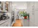 Bright kitchen featuring stainless steel appliances, hardwood floors and white cabinets at 612 Swift Ave, Durham, NC 27701