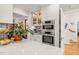 Updated kitchen featuring stainless appliances, a double oven, white cabinets, and marble countertops at 612 Swift Ave, Durham, NC 27701