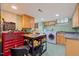 Spacious laundry room with modern washer and dryer, ample counter space, and storage cabinets at 612 Swift Ave, Durham, NC 27701