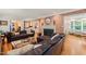Comfortable living room featuring a fireplace, leather sofas, and an inviting atmosphere at 612 Swift Ave, Durham, NC 27701