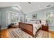Light filled main bedroom featuring a large bay window with bench seating and hardwood floors at 612 Swift Ave, Durham, NC 27701