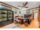 Home office with a large desk, built-in shelving, hardwood floors and natural light at 612 Swift Ave, Durham, NC 27701