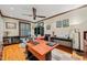 Spacious home office featuring hardwood floors, a large desk, and ample natural light at 612 Swift Ave, Durham, NC 27701