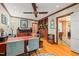 Home office with hardwood floors, a large desk, built-in shelving, and natural light at 612 Swift Ave, Durham, NC 27701