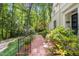 Landscaped brick walkway leading to the house showcases beautiful plantings and greenery at 612 Swift Ave, Durham, NC 27701