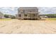 View of backyard and exterior of home with unfinished yard at 66 Sanders Farm Dr, Smithfield, NC 27577