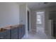 Bathroom with gray cabinets and walk in shower at 66 Sanders Farm Dr, Smithfield, NC 27577