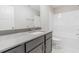 Bathroom showcasing a sleek vanity, stone countertop, and a combined shower and bathtub at 66 Sanders Farm Dr, Smithfield, NC 27577