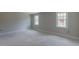Bedroom features neutral walls, large windows, and ample sunlight at 66 Sanders Farm Dr, Smithfield, NC 27577