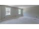 Bedroom with two large windows overlooking wooded area at 66 Sanders Farm Dr, Smithfield, NC 27577