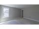 Bedroom with large window overlooking residential area at 66 Sanders Farm Dr, Smithfield, NC 27577