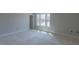 Bedroom features neutral walls, large windows, and ample sunlight at 66 Sanders Farm Dr, Smithfield, NC 27577
