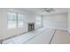 Bright living room with fireplace, large windows offering scenic views, and ceiling fan at 66 Sanders Farm Dr, Smithfield, NC 27577
