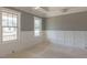 Future living room with wainscotting and large windows overlooking the front yard at 66 Sanders Farm Dr, Smithfield, NC 27577