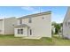 Exterior of a two-story home showcases the backyard, green grass, and light vinyl siding at 69 Curling Creek Dr # I286, Clayton, NC 27527