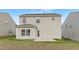 Exterior of a two-story home showcases the backyard, green grass, and light vinyl siding at 69 Curling Creek Dr # I286, Clayton, NC 27527