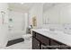 Bathroom featuring a shower-tub combo, vanity with dark cabinets, and neutral countertops at 69 Curling Creek Dr # I286, Clayton, NC 27527