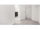 A bedroom with neutral carpet, and a doorway leading to the bathroom at 69 Curling Creek Dr # I286, Clayton, NC 27527