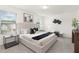 Bright bedroom with a large bed, neutral decor, and natural light from two windows at 69 Curling Creek Dr # I286, Clayton, NC 27527