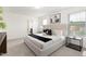 Spacious bedroom featuring neutral decor, a comfortable bed, and natural light at 69 Curling Creek Dr # I286, Clayton, NC 27527