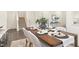 Elegant dining room with modern decor and a staircase in a well-lit interior at 69 Curling Creek Dr # I286, Clayton, NC 27527