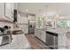 Well-equipped kitchen with stainless steel appliances, granite countertops, and ample cabinet space at 69 Curling Creek Dr # I286, Clayton, NC 27527