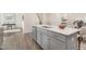 Kitchen island with quartz countertops, modern cabinets, stainless steel appliances, and open floorplan at 69 Curling Creek Dr # I286, Clayton, NC 27527