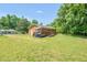 Expansive backyard featuring a brick home with a convenient ramp and lush green lawn at 714 W Mckinley St, Mebane, NC 27302