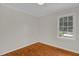 Bedroom featuring a window, neutral walls and wood flooring at 714 W Mckinley St, Mebane, NC 27302