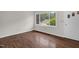 Bright bedroom with hardwood floors and large windows offering natural light at 714 W Mckinley St, Mebane, NC 27302