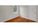 Bedroom featuring hardwood flooring, a window, and a closet at 714 W Mckinley St, Mebane, NC 27302