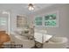 Dining room with a glass table and stylish white chairs at 714 W Mckinley St, Mebane, NC 27302